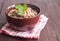 Delicious buckwheat porridge in a bowl on a wooden table