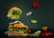 Delicious burger with flying ingredients on dark background