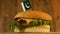 Delicious burger with small Pakistani flag on top of them with toothpicks. Yummy hamburger rotating.