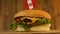Delicious burger with small Peruvian flag on top of them with toothpicks. Yummy hamburger rotating.
