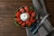 Delicious burrata cheese with tomatoes and basil served on wooden table, flat lay