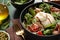 Delicious burrata salad served on green wooden table, closeup