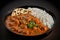 Delicious Butter Chicken Curry Tika Masala and Rice in a Bowl