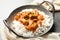 Delicious butter chicken with rice in dish and napkin