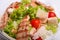 Delicious Caesar salad with chicken meat