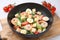 Delicious Caesar salad with shrimps on table, closeup