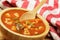 Delicious Canned Vegetable Soup on a wooden background