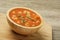 Delicious Canned Vegetable Soup on a wooden background