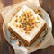 Delicious carrot or spice cake topped with creamy cheese frosting.