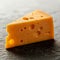 Delicious cheddar cheese wedge no packaging, perfect for cheese festivals