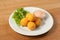 Delicious cheese croquettes on a plate with sauce