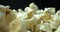 Delicious and chemical-free air-popped popcorn. Stovetop popcorn on black background.