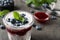 Delicious chia pudding with blueberries on grey table