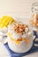 Delicious chia pudding with granola and mango on white table