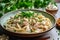 delicious chicken and pasta dish placed on sleek gray background, composition exudes warmth and comfort