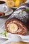 A delicious chocolate banana roll and coffee, closeup