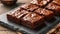 Delicious Chocolate Brownies With Nuts on Slate Board