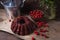 Delicious chocolate cake with sweet cherry, vintage kettle and bouquet of blue flowers on dark wooden background