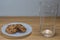 Delicious chocolate chip cookies. Empty glass on the side.