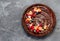 Delicious chocolate tart on gray background. Homemade desserts concept
