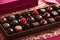 delicious chocolates with raspberries in box, closeup view. sweets and desserts