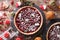 Delicious Christmas cranberry tart and festive decoration close-up. Horizontal top view