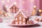 Delicious Christmas gingerbread in the shape of a house with pink glaze, a sweet tradition