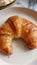 Delicious closeup view of freshly baked french croissant mouthwatering breakfast pastry