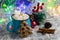 Delicious cocoa with cinnamon and marshmallows in a blue cup, star anise, cinnamon sticks, Christmas decor, garland and