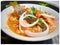 Delicious Colorful yummy indian spicy mushroom gravy in white bowl and it`s one of favorite restaurant cuisine food