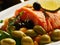 Delicious cooked salmon with olives and spices