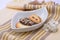 Delicious cookies and biscuits on white plate