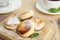 Delicious cottage cheese pancakes with sugar powder on board, closeup