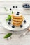 Delicious cottage cheese pancakes or syrniki with fresh blueberry