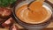 Delicious creamy tomato soup with whipping cream and fresh green parsley