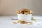 Delicious crispy coconut chips with salted caramel in a white plate on a white background. Natural product made from coconut pulp