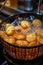 Delicious crispy golden potato chips deep fried to perfection in bubbling seasoned oil