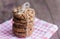 Delicious crispy oatmeal cookies with chocolate chips on a napkin