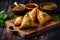 Delicious and crispy samosas with a spicy filling, served on a wooden plate with chutney and fresh herbs