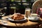 Delicious croissant and cup of coffee on a dark background