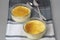 Delicious CrÃ¨me brÃ»lÃ©e presentation with two spoons .Burnt cream or creme brulee is a famous french dessert with caramelized