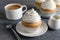 Delicious cupcake with cream on grey wooden table, closeup