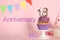 Delicious cupcake with number shaped candles on pink background. Coming of age party - 18th birthday. Anniversary celebration