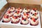 Delicious cupcakes with fresh berries raspberries, strawberries,  blueberry in a box