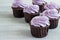 Delicious cupcakes with lilac cream