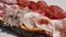 Delicious cutting board of fresh cold cuts on wooden plate. Bacon, coppa, salami and bresaola. Traditional Italian mountain dish