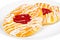 Delicious danish pastry on a plate, on white background