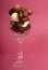 Delicious dark and semi-sweet chocolates in a cut crystal wine g