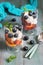 Delicious dietary dessert with curd cream blueberries and peach, sprinkled with sugar powder and decorated with mint leaves. Green