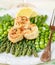 A delicious dinner of roasted scallops and asparagus